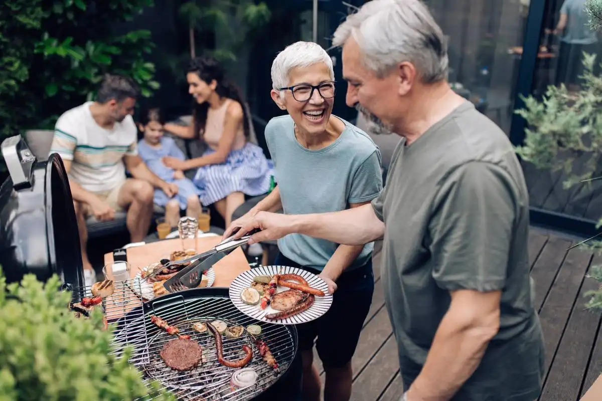 senior cooking meat